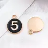 Conjunto Misto de 23 Acessórios DIY: Bolsa de Perfume Estilo Chanel Preto e Branco, Pingentes de Esmalte, Brincos de Liga, Chaveiros, Pequenos Charms