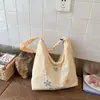 Bolsa de lona casual estilo ins coreano de grande capacidade 2026 nova fresca bordada para estudante bolsa transversal casual para mulheres