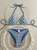 Nuevo traje de baño de dos piezas estilo europeo y americano para mujer, bikini sexy de rayas con cuello halter y diseño elegante y espalda descubierta, traje de baño transfronterizo para mujer