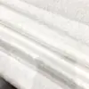 Nuevo tejido jacquard de patrón oscuro de flores pequeñas estilo chino ligeramente transparente suave agradable a la piel jacquard de Tencel tejido para Hanfu cheongsam de primavera y verano