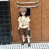 Camisetas para niños y niñas ropa de verano 2026 nuevo moderno genial moda estampado de grafiti popular manga corta pantalones cortos conjunto de dos piezas