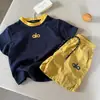 Ropa para Niños 2026 Conjunto de Verano para Niños Conjunto de Dos Piezas Estilo Coreano Conjunto de Shorts de Manga Corta para Niños Ropa Ligera Elegante para Bebé Moderna