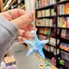 Llavero de estrella de mar acrílica edición limitada de verano colgante de océano accesorio de bolsa asequible para estudiantes decoración pequeña fresca regalo