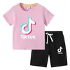 Camiseta infantil 2022 TikTok verão nova vestuário infantil de comércio exterior roupas infantis coreanas calça de manga curta terno de duas peças
