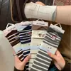 Calcetines grises para mujer, calcetines holgados para primavera y otoño, lindo perrito de dibujos animados estilo japonés, versión coreana, calcetines de media pantorrilla de moda para estudiantes, estilo Ins