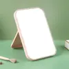 Espejo de maquillaje 3D de plástico de color sólido, espejo de tocador 3D portátil, espejo pequeño plegable de alta definición para escritorio de dormitorio de estudiante