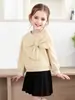 Conjunto de Moletom Elegante com Laço para Meninas (Primavera/Outono) + Saia Plissada Preta, Fornecimento Transfronteiriço de Roupas Infantis