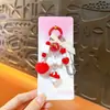 Llavero colgante de muñeca pequeña creativa, colgante de mochila lindo estilo Miu, llavero de accesorios pequeños para DIY al por mayor