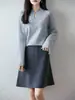 Colección nueva otoño/invierno 2026 transfronteriza: falda midi de punto de lana pura para mujer, de cintura alta, versátil, ajustada y de línea A corta