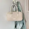 Bolso de mano único para mujer, bolso de hombro Boston, nuevo bolso cruzado tejido casual de moda 2026, bolso tipo almohada versátil