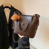 Venta al por mayor del fabricante Bolsos pequeños de moda retro Bolsos para mujer 2026 Nuevo de moda Correa doble para el hombro Bolso bandolera retro Versátil tipo cubo