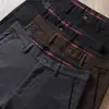 Estación europea otoño e invierno algodón modal sarga microelástico simple negocios lavado cintura media ajuste recto pantalones casuales para hombre
