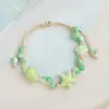 Jingdezhen Navidad Pulsera de Cuerda Trenzada de Cerámica Pulsera de Trébol de Cuatro Hojas Joyería Artística Hecha a Mano Venta al por Mayor Pulseras de Cerámica para Atracciones Turísticas