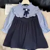 Vestido infantil de manga longa, gola de camisa, vestido patchwork, saia em camadas (tipo bolo), novo estilo de comércio exterior para primavera e outono de 2026, para idades de 3 a 8 anos