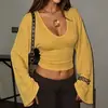 Ropa Femenina Transfronteriza Europea y Americana Otoño/Invierno 2026: Top Picante de Chica con Escote en V Profundo, Texturizado, Acampanado, Manga Larga y Cintura Corta Ceñida