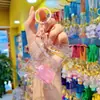 Llavero de Botella de Té con Leche de Color Transparente Colgante de Resina Llavero para Coche Bolsa Colgante de Botella Exquisito Regalo Pequeño