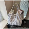 Bolsa de Lona Bolsa Tote de Gran Capacidad para Mujeres 2025 Nuevo Verano Nicho Rayada Simple Moda Bolso Bandolera Bolso de Hombro