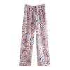 Aliexpress Venta al por mayor de ropa europea y americana transfronteriza para mujer Primavera temprana 2025 Nuevo Pantalones casuales de satén con graffiti de anacardo de temperamento