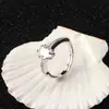 Anillo clásico con garras y gema ovalada, moderno y exquisito, con diseño en forma de huevo, versátil, estilo moderno y diseño de alta gama, adecuado para exportación