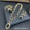 Nuevo Conjunto de Joyería Incrustado Ojo de Gato Lujo Ligero Gama Alta Diamante Completo Collar de Banquete Pulsera de Perla y Cristal Anillo