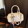 2025 Nuevo Estilo Coreano de Moda Simple Diseño de Nicho Bolso de Bowling para Viajar Dulce Elegante Moderno Bolso Cruzado para Mujer