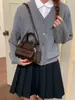 Bolsa transversal feminina nicho 2026, bolsa de mão concha fashion, versão coreana ins tendência bolsa de ombro com laço única
