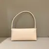 Bolsa de axila de nicho retrô de luxo leve para mulheres, novo modelo da primavera de 2026, bolsa baguette simples elegante e chique para ombro e transversal