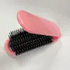 Peine de plástico portátil para el cabello, nuevo estilo, con espejo de maquillaje y bolsa de aire.