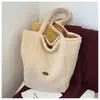 Bolsa Tote Casual de Diseño de Nicho Nuevo Otoño 2025 Bolso de Mano Casual Moda Textura Retro Bolso de Hombro para Mujer