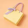 Ventas Directas de Fábrica Bolsas de Tote de Papel Kraft Grueso Bolsas de Compras para Ropa Regalo Bolsas de Papel de Empaque Rosa Al por Mayor