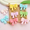Dibujos animados lazo brillante accesorios de resina diy funda de teléfono móvil refrigerador soporte para teléfono móvil parche material para accesorios de cabello venta al por mayor