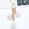 Ins estilo japonês letra de flor personalizada bola de pelo chaveiro pingente de capa de celular pingente de bolsa feminina fresco simples