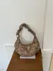 Bolso de leopardo de nicho súper popular para mujer de otoño e invierno 2026 nuevo estilo bolso cruzado plisado retro bolso de un solo hombro para debajo del brazo de moda