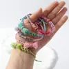 Pulsera Tejida Finamente con Borlas de Flor de Durazno Nueva de Primavera, Tamaño Ajustable para Hombres y Mujeres, Diseño Multicolor de Flor de Durazno, Adecuada para Estudiantes y Zonas Turísticas