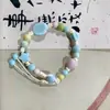 Pulseira de Corda Trançada em Cerâmica de Jingdezhen, Estilo Fresco e Simples, Design de Flor de Pedra, Joia de Mão Artística e Fofa, Fornecimento Atacadista para Áreas Turísticas