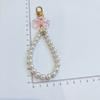 Llavero colgante de lazo de cadena de perlas DIY nuevo metal flor accesorios de tarjeta bolsa para audífonos accesorios para llaves femeninos