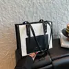 Bolso grande para mujer, bolso de mano de estilo popular de celebridades de Internet, bolso de hombro con textura, bolso de trabajo de gran capacidad para mujer, bolso de hombro con textura.