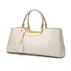 Fabricantes moda europea y americana pegamento ligero charol portátil bolso de mujer hombro diagonal bolso de boda bolso de novia banquete