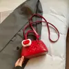 Primavera 2026 Nuevo Estilo Coreano Lunares Concha Bolso para Niños Padre-Hijo Bolso Cruzado para Teléfono para Mujeres Venta al por Mayor