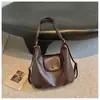 Bolsa Tote Feminina 2026 Nova Mochila de Grande Capacidade para o Dia a Dia Bolsa de Ombro com Design Pequeno de Nicho Mochila Leve para Viagem