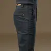 Pantalones casuales negros de alta gama para hombre, nuevos, corte slim, corte recto, elásticos, versátiles, pantalones de vestir sencillos para primavera y otoño