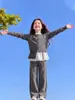 Conjunto de Roupa para Meninas Primavera e Outono 2026 Novo Suéter Cardigan Infantil Estiloso com Barra de Renda e Calça Wide-Leg Conjunto de Duas Peças Tendência