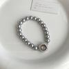 Pulsera de lujo ligera de alta calidad con perla Shijia, color cáñamo auténtico, con hebilla de fritilaria blanca australiana, pulsera retro exquisita para niña.
