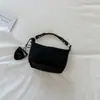 Bolso de hombro para mujer de diseño nicho estilo francés transfronterizo, bolso de axila con patrón tejido, bolso de mano de moda y fresco para el trabajo para mujer