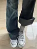 Jeans acampanados vintage lavados de tiro bajo en color gris azulado para mujer, colección otoño 2026, corte ceñido, rejuvenecedores, pantalones largos en forma de herradura