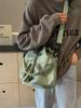 Nuevo bolso de cubo con cordón de tela de nailon de moda de estilo coreano, bolso de hombro portátil personalizado que combina con todo, bolso de mensajero informal de uso diario