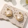 Pendientes Elegantes Vintage de Cuero de Leopardo con Perlas Pendientes para Mujer Nuevos de Alto Nivel Redondos Anillo en C Pendientes con Cierre de Perla