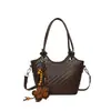 Bolso pequeño de moda de verano para mujer, nuevo estilo 2026, bolso tipo cubo con patrón tejido simple, bolso de hombro y bolso cruzado versátil