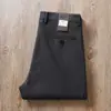 Pantalones casuales rectos de algodón modal refinado suave y cómodo de cintura media elástica para otoño e invierno, color caqui, de alta gama, ropa formal para mediana edad