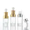 Botella de aceite esencia vidrio cabeza de goma gotero botella stock líquido esencia botella transparente cosméticos sub-botella